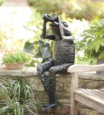 handcrafted metal frog with binoculars