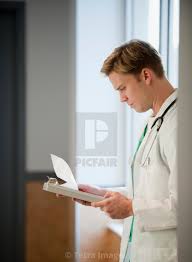 Doctor Reading Medical Chart License Download Or Print