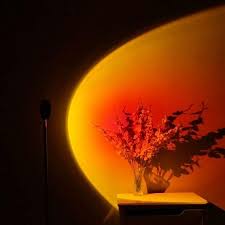 Aesthetic background with light sunset projector lamp. Tiktokers Love This Lamp That Mimics A Sunset I Desperately Need This