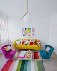 yellow sofa and colourful armchairs