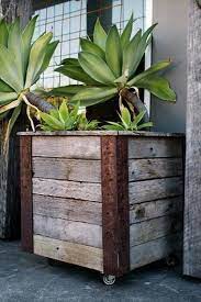 You can use stainless steel or even an old watering trough or barrel to put your soil and plants in. Pin On Pallet Planters