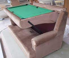old sofa hides pool table underneath