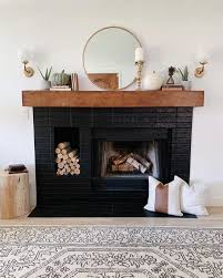 A Stylish Black Brick Fireplace With A