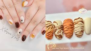 10 tiger themed nails below 80 to rock