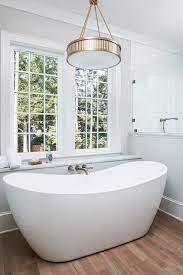 over oval freestanding bathtub