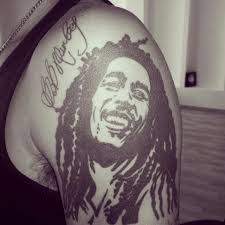 Bob marley smoking pipe tattoo on sleeve. Bob Marley Tattoos 15