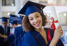 female college graduate in cap and gown
