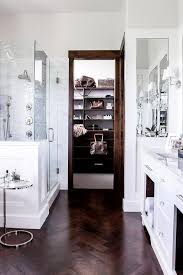 white bathroom with dark wood trim
