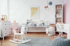 bright baby room with white furniture