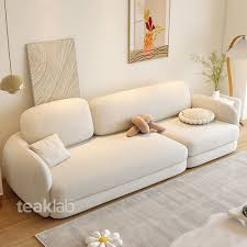 inviting fabric sofa in teak frame