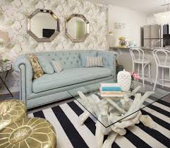 Loving the parisian inspired couch, the bold striped rug and the beautiful wallpaper which it brings everything together. Howhome Decorated By Jillian Harris Eclectic Living Room Calgary By Brookfield Residential Yyc Houzz