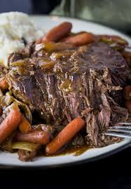 This crock pot roast recipe is the ultimate weeknight meal providing the family with a much needed delicious meal after a long day at work or school. Mississippi Pot Roast The Cozy Cook