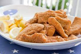 cornmeal coated fried catfish cooking