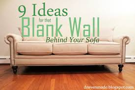 blank wall behind the sofa