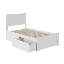 white bed frame with drawers on
