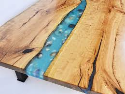 The blue resin makes it look like there was a river. Photos Of Epoxy Resin River Coffee Tables Sold Online 800