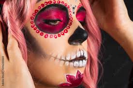woman with sugar skull makeup and pink