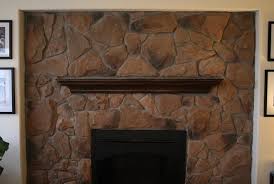 Two Story Stone Fireplace In Home
