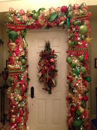Using artificial flowers, gold ornaments and deep burgundy and gold ribbon the flocked christmas tree pops in gorgeous christmas traditional colors! Red Green And Gold Christmas Garland Tothegoodlifewithme Wordpress Com Christmas Door Decorations Red And Gold Christmas Tree Christmas Centerpieces
