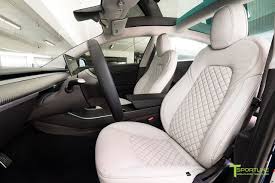 (inside the tube, it actually rests on the ground in a way that looks like it got accidentally left there.) Tesla Model 3 Seat Upgrade Interior Kit Signature Diamond Design Custom Car Interior Tesla Model Tesla