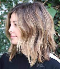 This haircut has interesting side bangs. 50 Best Medium Length Hairstyles For 2021 Hair Adviser