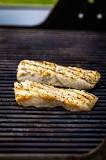 How long do you cook fish on the grill and what temperature?