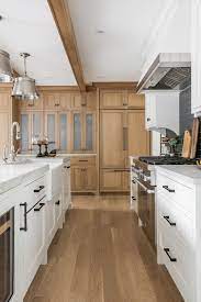 white and stained white oak cabinets