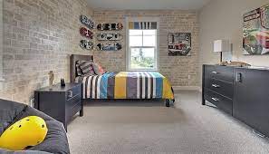 What should be in a teenage boy's room? 25 Vivacious Kids Rooms With Brick Walls Full Of Personality Brick Wallpaper Bedroom Boys Bedroom Wallpaper Wallpaper Bedroom