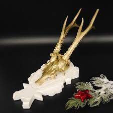 deer antlers gold coloured white shield