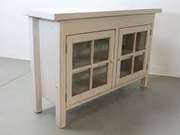 small media cabinet with glass doors