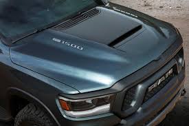 Pricing for such a setup starts at $36,225 and includes the r/t's vented hood, big wheels, and monochromatic styling, as well as a dizzying array of amenities compared with sport trucks of yore: Mopar Cooking Up Badass New Hood For Ram 1500 Carbuzz