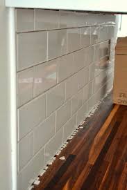 Installing tile backsplash is an easy, thrifty, and beautiful way to update your kitchen or bathroom. How To Tile A Backsplash In The Kitchen Kitchen Design Diy Glass Tiles Kitchen Kitchen Backsplash Edge