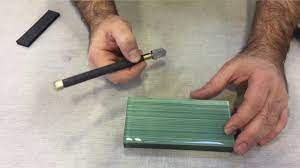 cutting glass tile using the score and