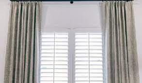 pair curtains with plantation shutters