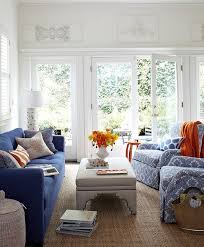 blue sofa with gray linen ottoman as