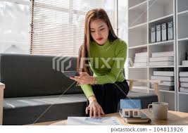 woman sitting on cozy sofa and planning
