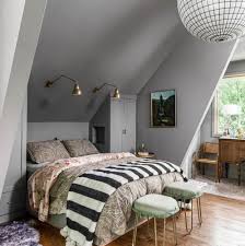 a bedroom with a slanted ceiling