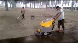 cleaning big warehouse concrete floor