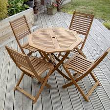 This cool and clean wooden construction is a comfortable, easy to fold garden chair. Folding Wooden Table And Chairs For The Garden Savvysurf Co Uk