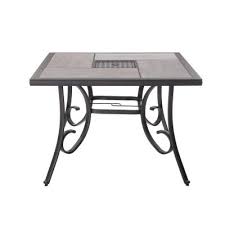 Square metal outdoor patio bistro dining table with center umbrella hole and cast iron stylish design. Standard Dining Height Seats 4 People Brown Patio Dining Tables Patio Tables The Home Depot