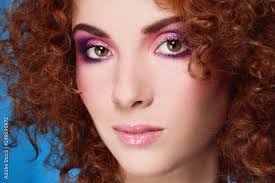 curly hair and disco makeup stock photo