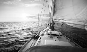 calm sailing boat sailing over the sea