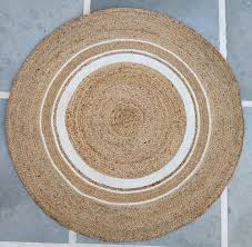 white and brown round jute mat for