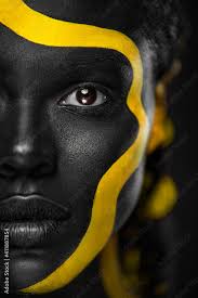 yellow and black body paint woman with