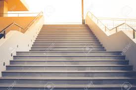 Concrete steps and stairs design tips including estimating concrete steps,. Front View Of Empty Concrete Staircase With Metal Railing That Going Up To Top Floor With Sunlight In The Background Stock Photo Picture And Royalty Free Image Image 94449200