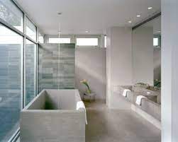 freestanding tub and concrete floors