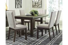Table made of replicated veneers and engineered wood. Dellbeck Extendable Dining Table Ashley Furniture Homestore