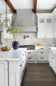 28 white cabinets with black hardware