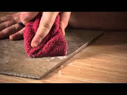 remove carpet adhesive from tiles