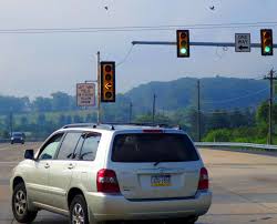 what do flashing yellow signals mean